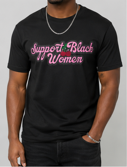 Black t-shirt with 'Support Black Women' text worn by a person on a gray background